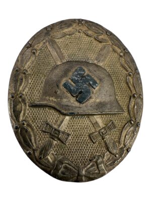 Silver wound badge "65"
